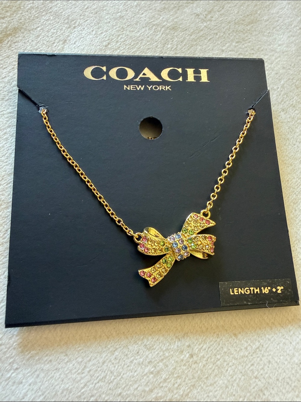 Coach Gold-tone Bow Necklace with Multicolor Crystals